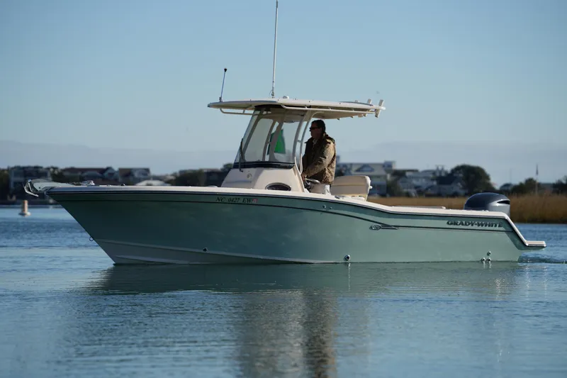 Slide: The Image of 2018 Grady-White Fisherman 236 boat cruising on calm water. - 11