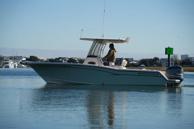 Slide: The Image of 2018 Grady-White Fisherman 236 boat cruising on calm water. - 13