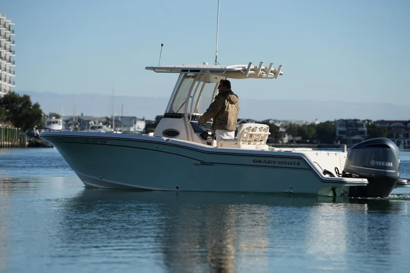 Slide: The Image of 2018 Grady-White Fisherman 236 boat on calm water, side view. - 15