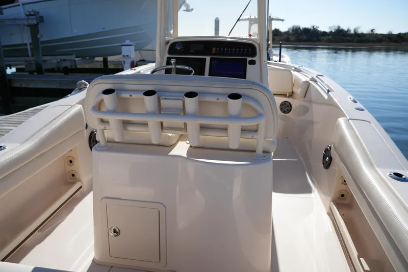 Slide: The Image of 2018 Grady-White Fisherman 236 boat interior with rod holders and console. - 26