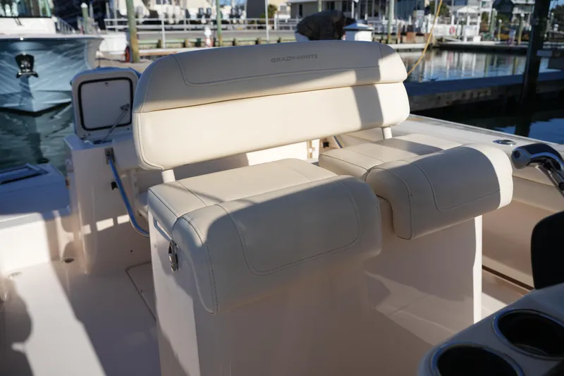 Slide: The Image of 2018 Grady-White Fisherman 236 boat seating area with beige upholstery. - 27