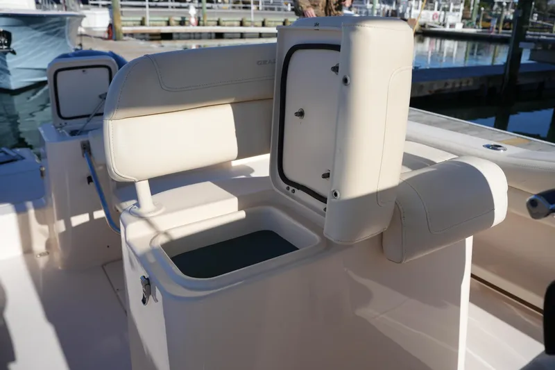 Slide: The Image of 2018 Grady-White Fisherman 236 boat interior with open storage compartment. - 28