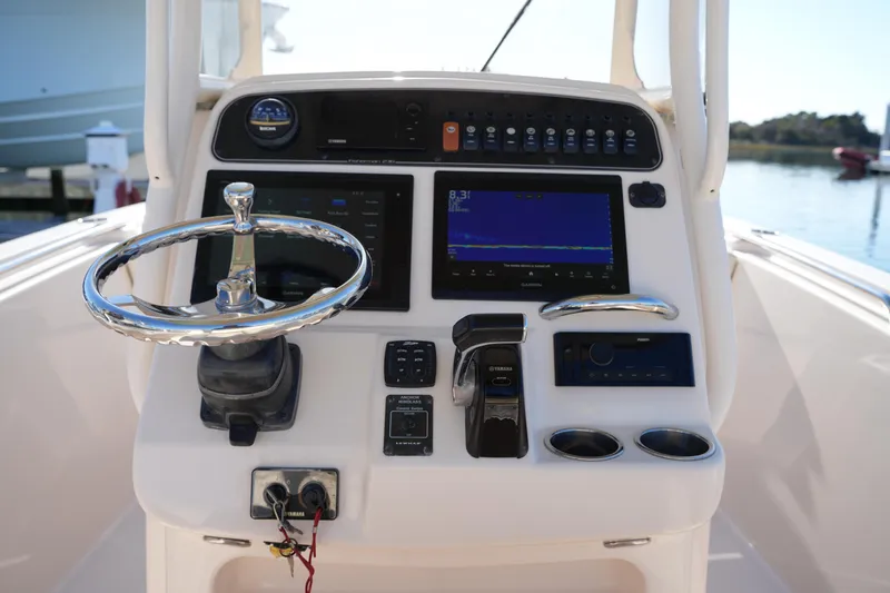 Slide: The Image of Control panel of 2018 Grady-White Fisherman 236 boat with steering wheel and navigation display. - 29