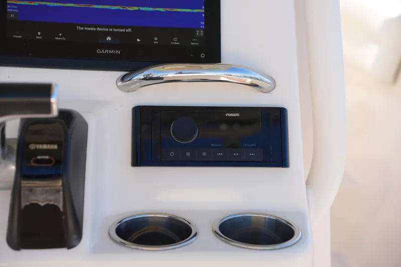 Slide: The Image of 2018 Grady-White Fisherman 236 dashboard with Garmin display and Fusion audio system. - 31