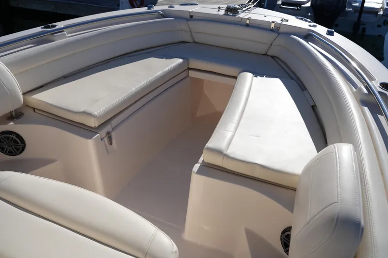 Slide: The Image of 2018 Grady-White Fisherman 236 boat interior with cushioned seating. - 40