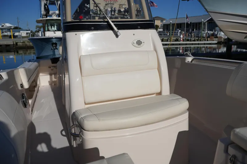 Slide: The Image of 2018 Grady-White Fisherman 236 boat interior with cushioned seating and console. - 42