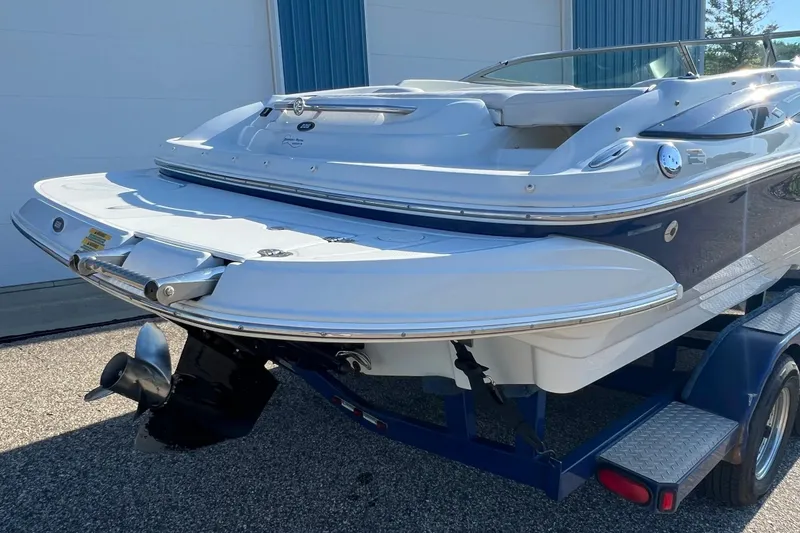 Slide: The Image of 2005 Crownline 226 LS boat on trailer, rear view showing swim platform and propeller. - 3
