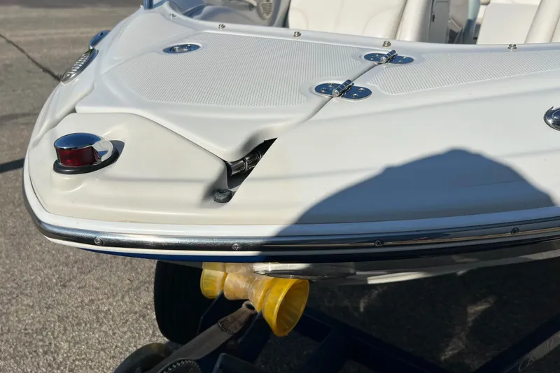 Slide: The Image of 2005 Crownline 226 LS boat with visible bow damage on trailer. - 7