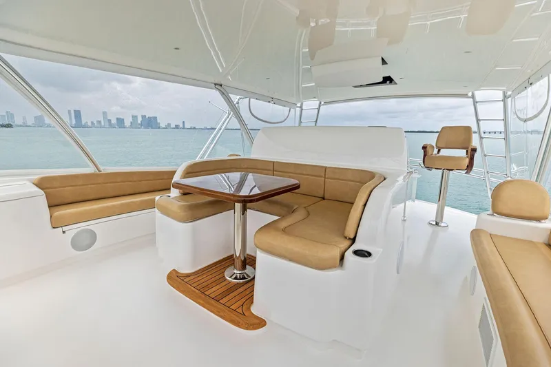 Slide: The Image of Luxurious interior of 2018 Viking 80 Convertible yacht with city skyline view. - 13