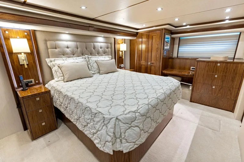 Slide: The Image of Luxurious bedroom interior of 2018 Viking 80 Convertible yacht with elegant wood finishes. - 20