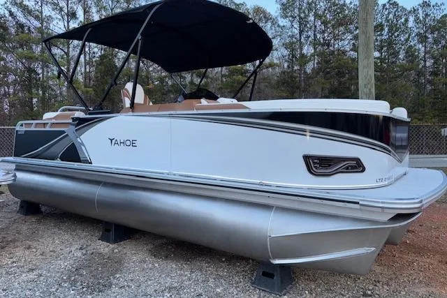 The Image of 2026 Tahoe Pontoon LTZ 2185 ELITE, sleek design, parked outdoors, side view. - 1