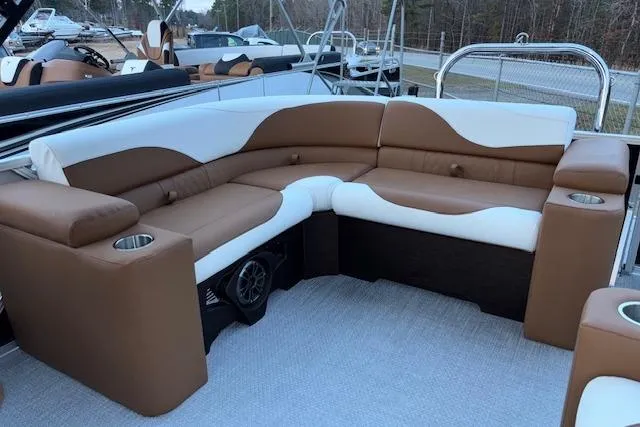 Slide: The Image of 2026 Tahoe Pontoon LTZ 2185 ELITE with luxurious brown and white seating. - 11