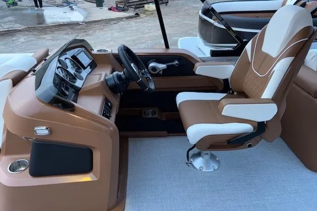 Slide: The Image of 2026 Tahoe Pontoon LTZ 2185 ELITE interior with modern helm and captain's chair. - 14