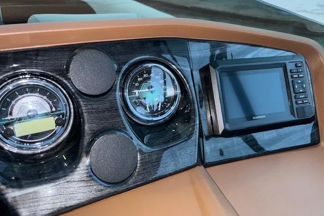 Slide: The Image of Dashboard of 2026 Tahoe Pontoon LTZ 2185 ELITE with gauges and Garmin display. - 17