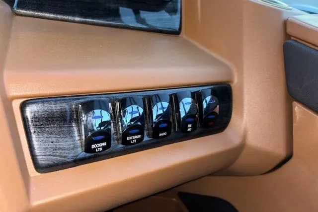 Slide: The Image of Control panel of 2026 Tahoe Pontoon LTZ 2185 ELITE with labeled switches. - 20