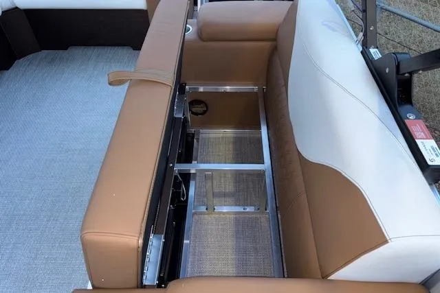 Slide: The Image of 2026 Tahoe Pontoon LTZ 2185 ELITE interior seating with storage compartment. - 27