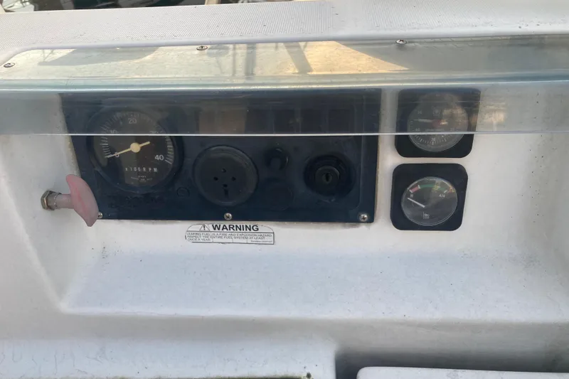 Slide: The Image of Control panel of a 2000 Beneteau Oceanis 361 sailboat with gauges and warning label. - 11