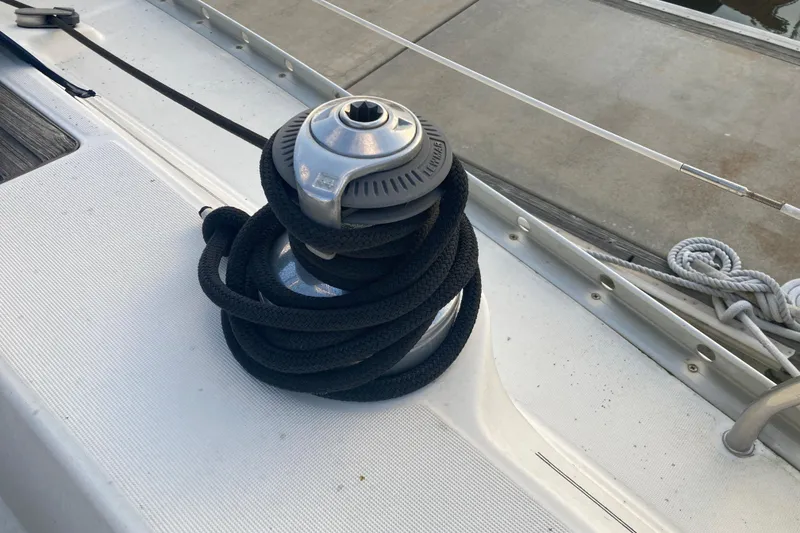 Slide: The Image of Winch with black rope on 2000 Beneteau Oceanis 361 sailboat deck. - 12