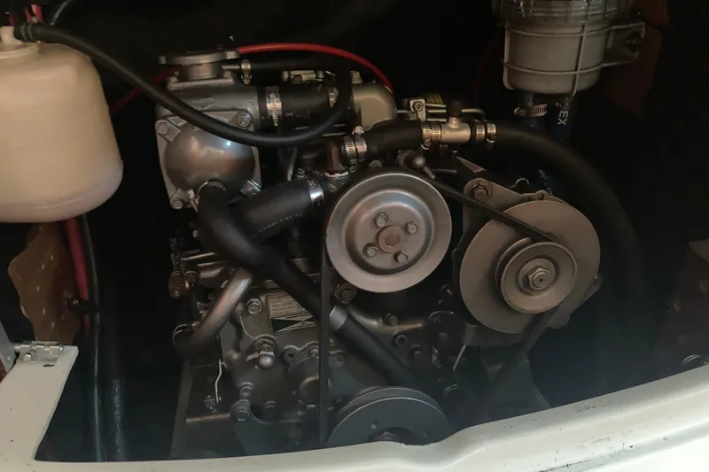 Slide: The Image of Engine of a 2000 Beneteau Oceanis 361 sailboat, showcasing mechanical components. - 24