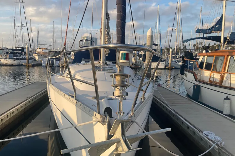 Slide: The Image of Beneteau Oceanis 361 sailboat docked in marina, 2000 model, surrounded by other boats. - 3