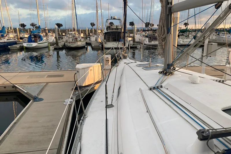 Slide: The Image of Beneteau Oceanis 361 sailboat docked at marina, surrounded by other boats, 2000 model. - 4