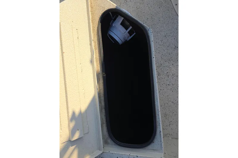 Slide: The Image of Open storage compartment on 2013 Xpress H20B Bay boat. - 10