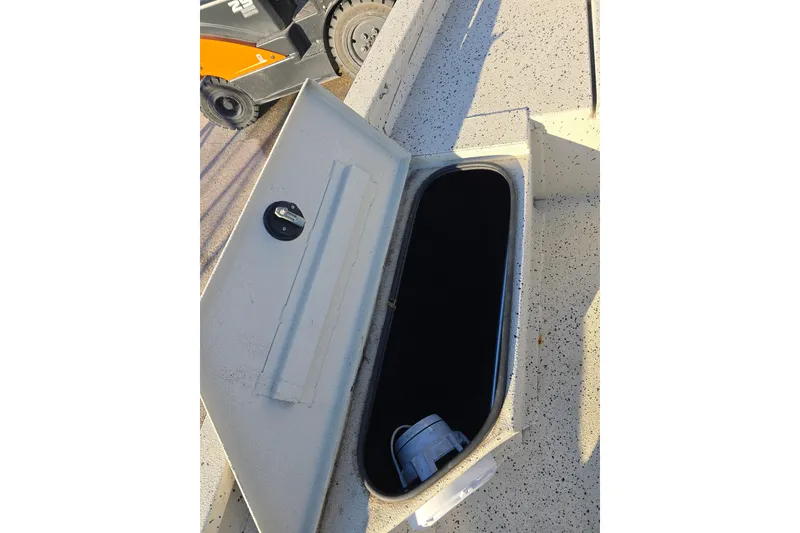 Slide: The Image of Open storage compartment on 2013 Xpress H20B Bay boat deck. - 11