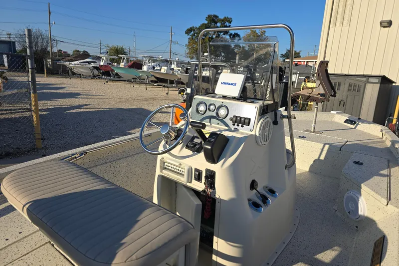 Slide: The Image of 2013 Xpress H20B Bay boat interior with steering console and navigation equipment. - 7