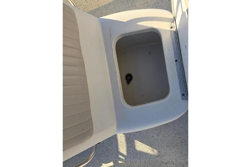 Slide: The Image of 2013 Xpress H20B Bay boat storage compartment with open lid. - 9