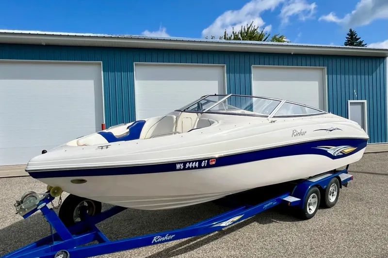 Slide: The Image of Propeller of 2004 Rinker 232 Captiva Bowrider boat on concrete floor. - 19