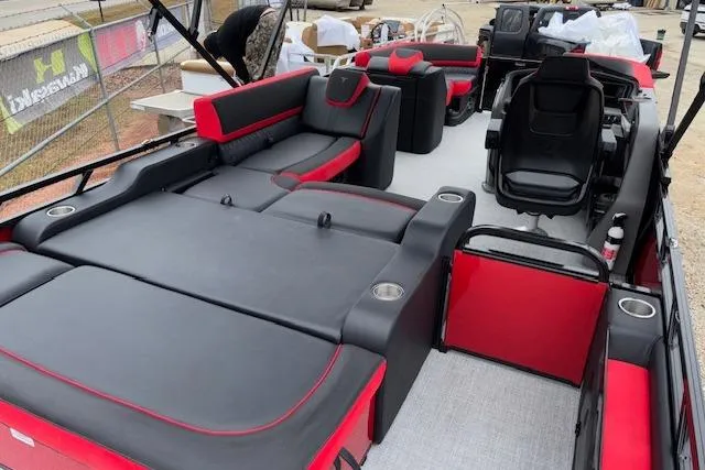 Slide: The Image of 2026 Tahoe Pontoon LTZ 2385 VRB Tritoon with luxurious red and black seating. - 12