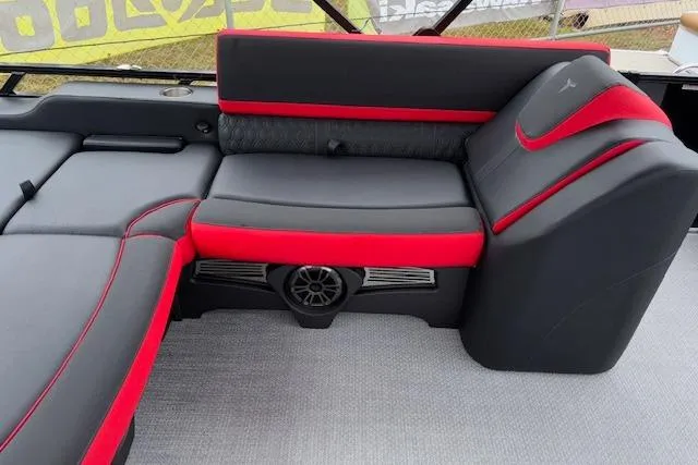 Slide: The Image of 2026 Tahoe Pontoon LTZ 2385 VRB Tritoon interior with red and black seating. - 14