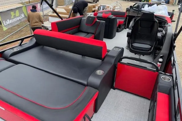 Slide: The Image of 2026 Tahoe Pontoon LTZ 2385 VRB Tritoon with red and black seating, spacious layout. - 15