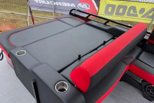 Slide: The Image of 2026 Tahoe Pontoon LTZ 2385 VRB Tritoon with red and black seating, cup holders, and sleek design. - 17