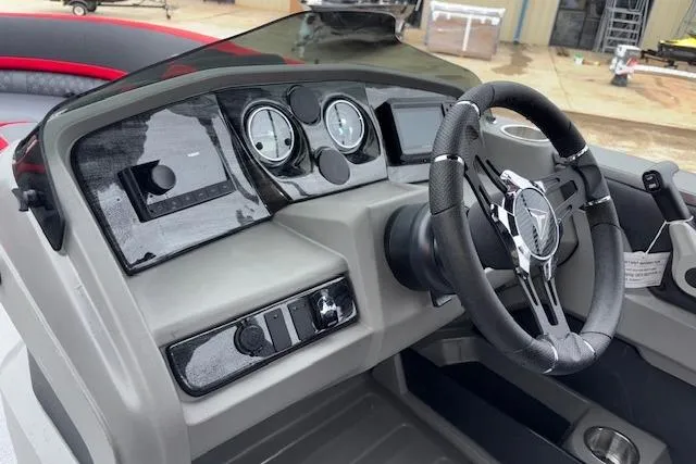 Slide: The Image of Steering console of 2026 Tahoe Pontoon LTZ 2385 VRB Tritoon with modern gauges and controls. - 20