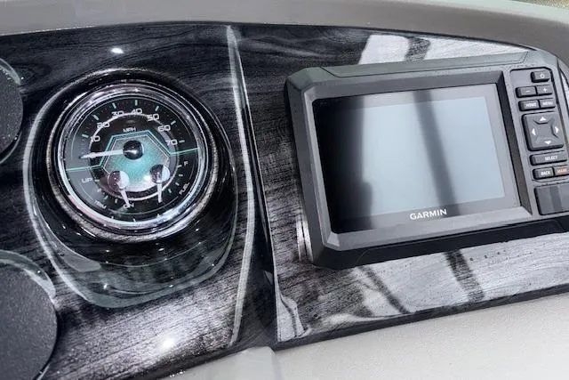 Slide: The Image of Dashboard of 2026 Tahoe Pontoon LTZ 2385 VRB Tritoon with Garmin display and speedometer. - 22