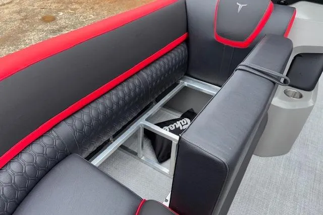 Slide: The Image of 2026 Tahoe Pontoon LTZ 2385 VRB Tritoon interior with black and red seating. - 28