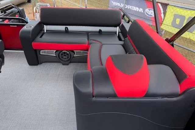 Slide: The Image of 2026 Tahoe Pontoon LTZ 2385 VRB Tritoon interior with red and black seating. - 31