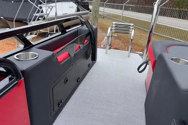 Slide: The Image of 2026 Tahoe Pontoon LTZ 2385 VRB Tritoon interior with seating and ladder. - 32