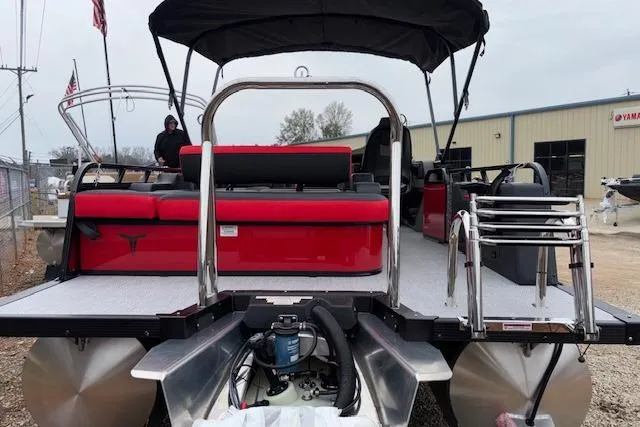 Slide: The Image of 2026 Tahoe Pontoon LTZ 2385 VRB Tritoon with red seating and stainless steel features. - 6