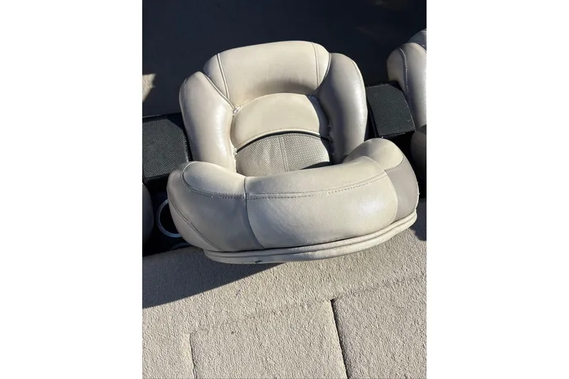 Slide: The Image of Gray leather seat of a 2013 Nitro Z-7 boat, shown in sunlight. - 14