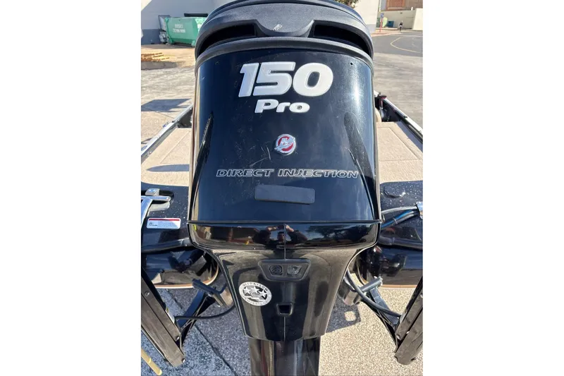 Slide: The Image of 2013 Nitro Z-7 boat engine, 150 Pro Direct Injection, in a parking lot. - 18