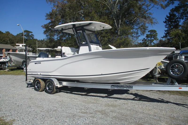 The Image of 2026 Sea Fox 248 Commander boat on trailer, parked outdoors. - 0
