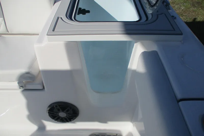 Slide: The Image of 2026 Sea Fox 248 Commander boat interior with storage compartment and speaker. - 13