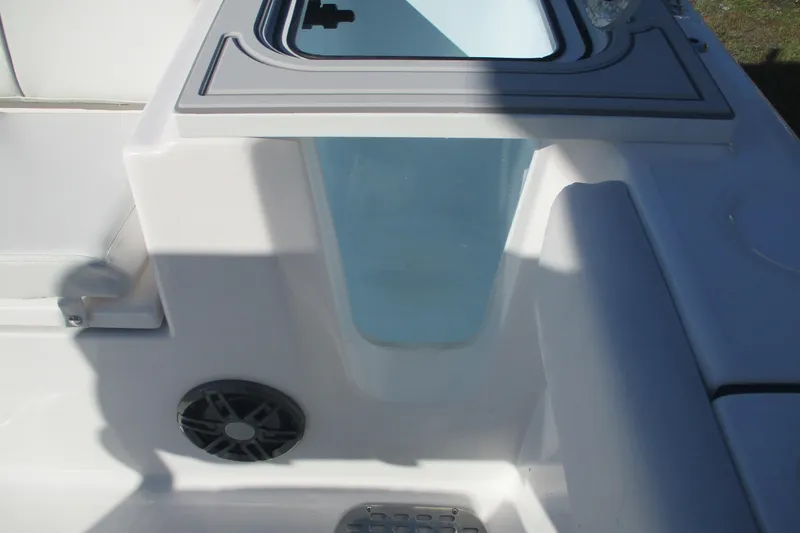 Slide: The Image of 2026 Sea Fox 248 Commander boat interior with storage compartment and speaker. - 16