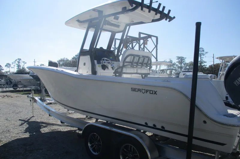 Slide: The Image of 2026 Sea Fox 248 Commander boat on trailer, side view, outdoors. - 5