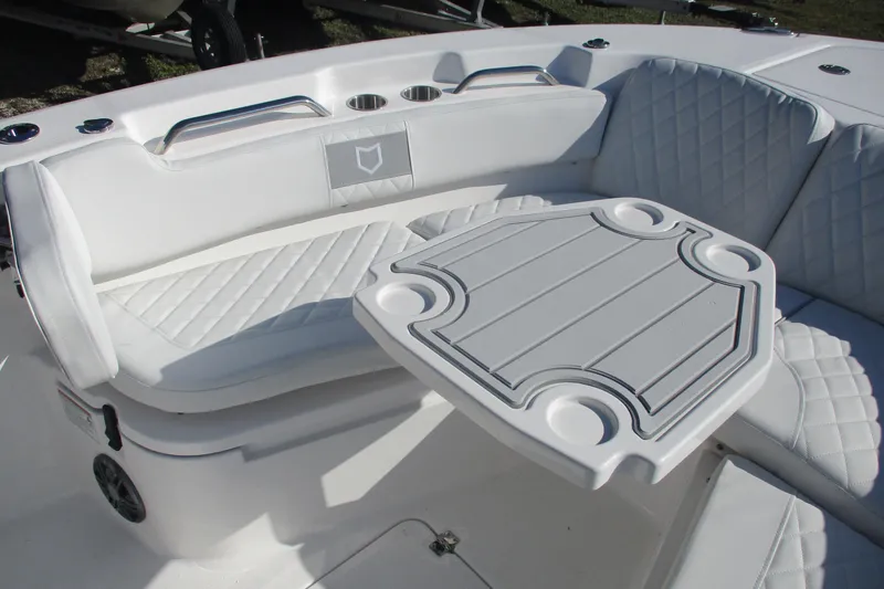 Slide: The Image of Luxurious seating area on 2026 Sea Fox 248 Commander boat with table and cup holders. - 9