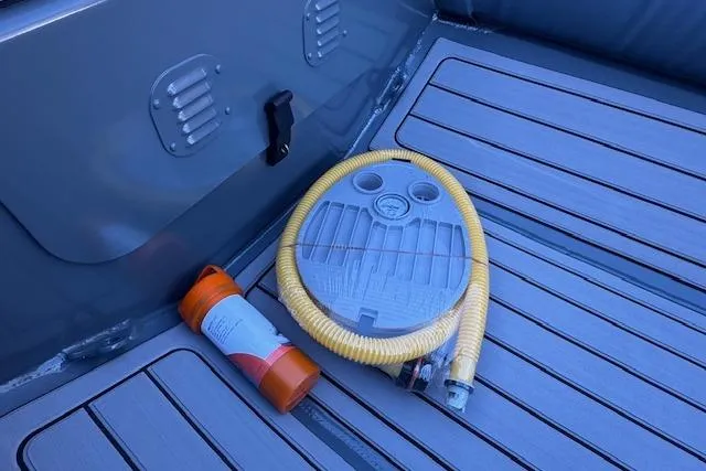 Slide: The Image of 2025 Highfield Classic 340 boat interior with pump and safety equipment. - 7