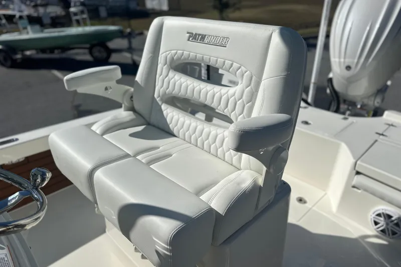 Slide: The Image of Luxury seating on 2026 Pathfinder 2500 Hybrid boat, featuring white cushioned design. - 11
