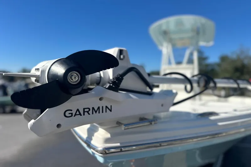 Slide: The Image of 2026 Pathfinder 2500 Hybrid boat with Garmin trolling motor, clear blue sky background. - 12